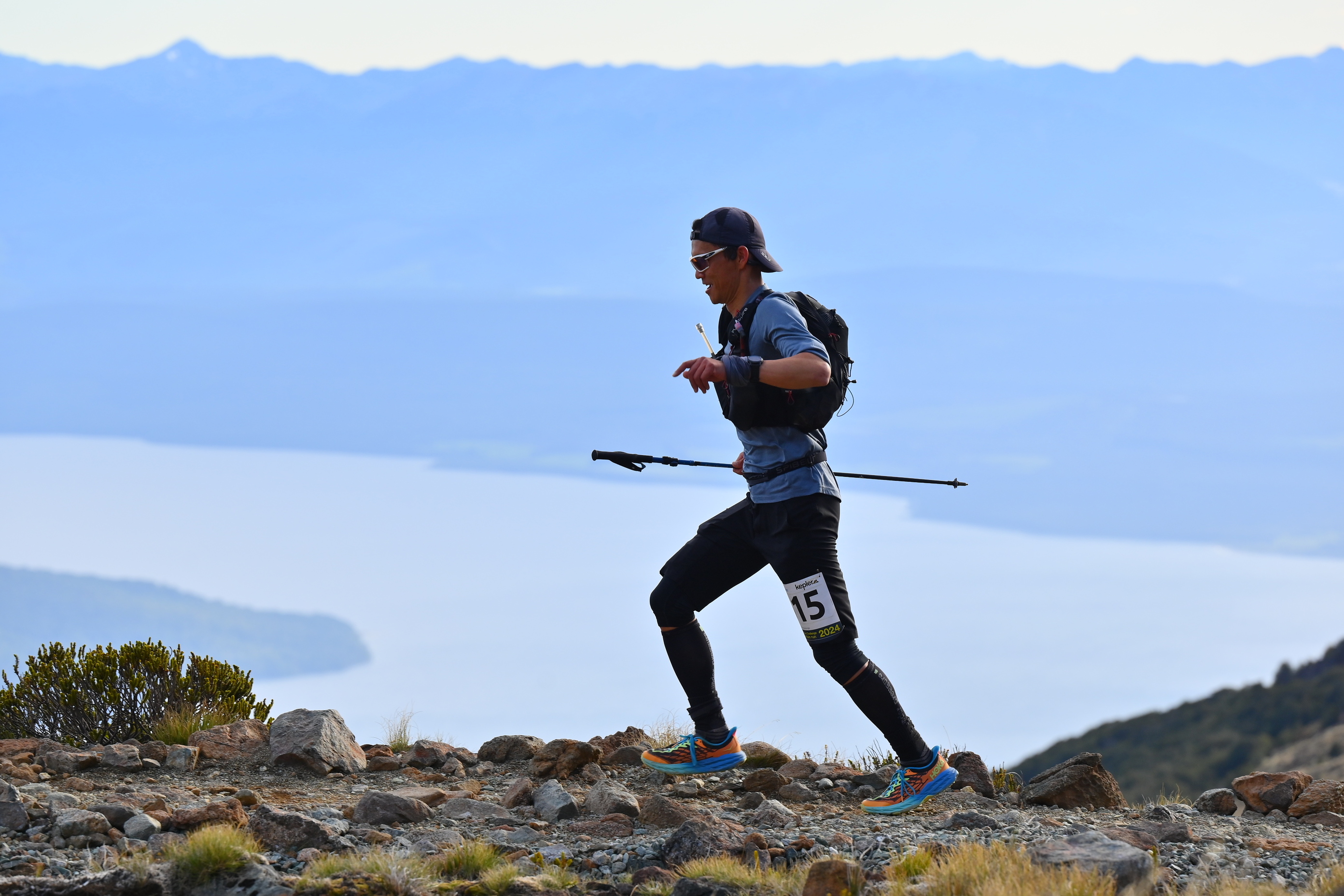 Sam Ng trail racing above Lake Te Anau, New Zealand